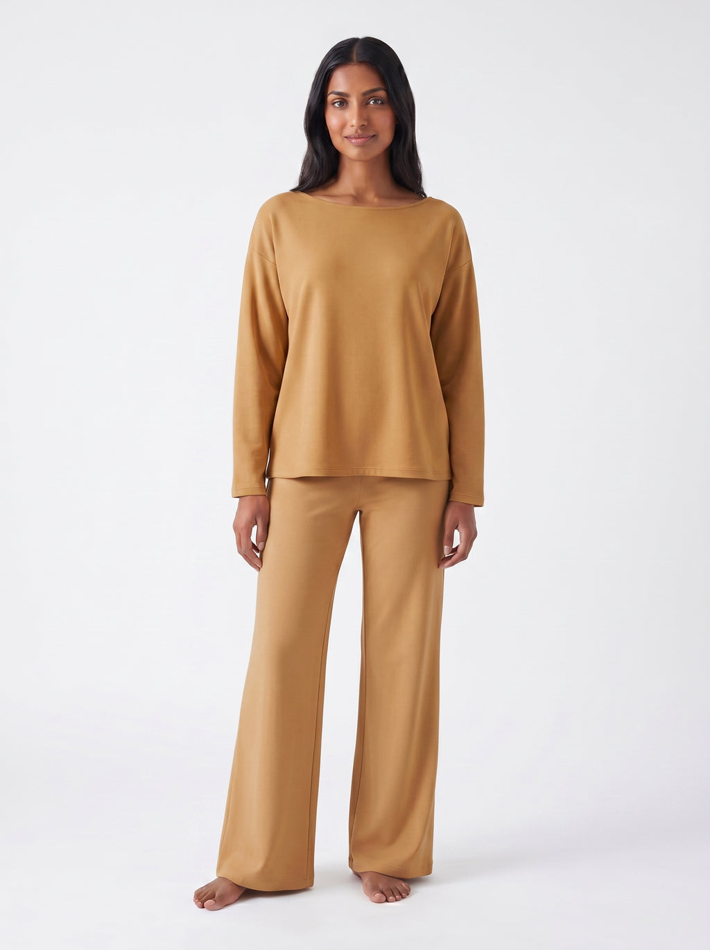 Woman wearing a Caramel bamboo loungewear set on a white background