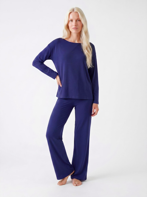 Woman wearing a Midnight blue bamboo loungewear set on a white background