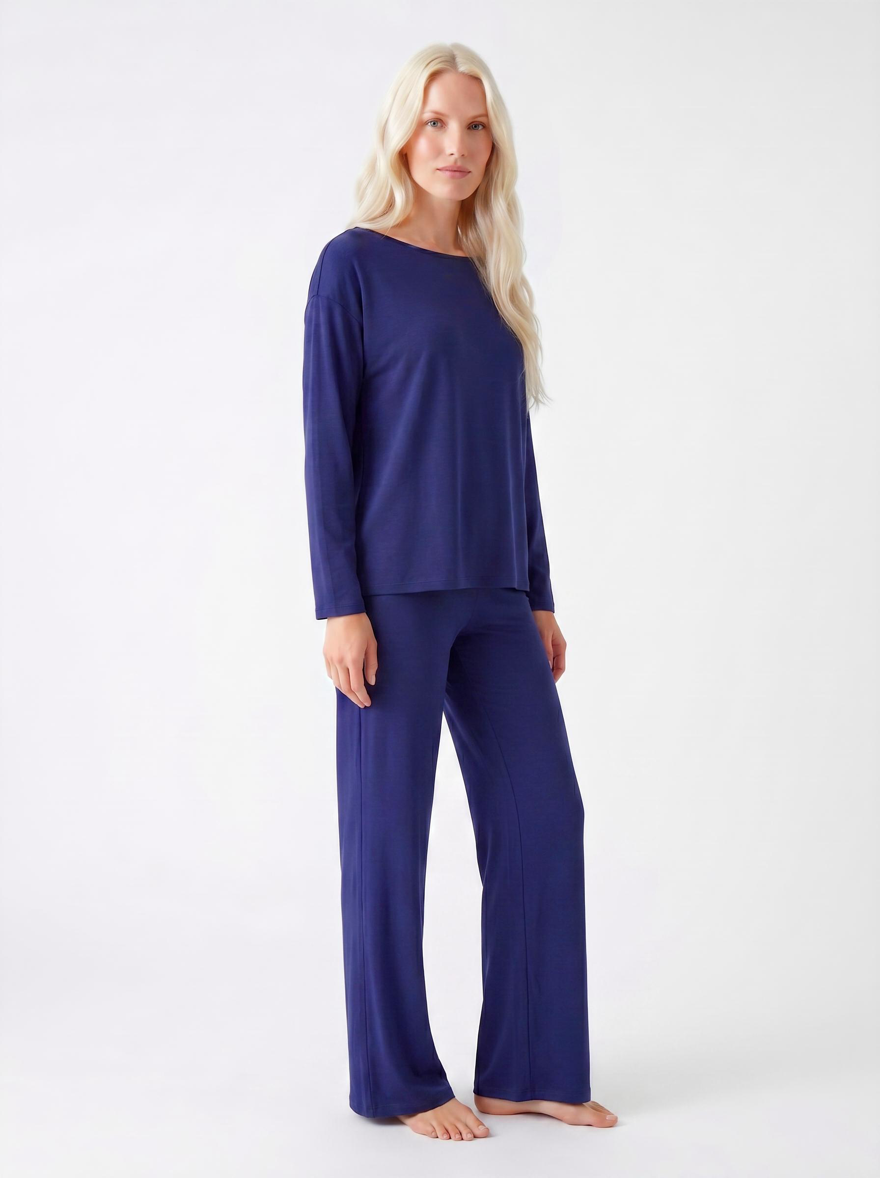 Woman wearing a Midnight blue bamboo loungewear set on a white background