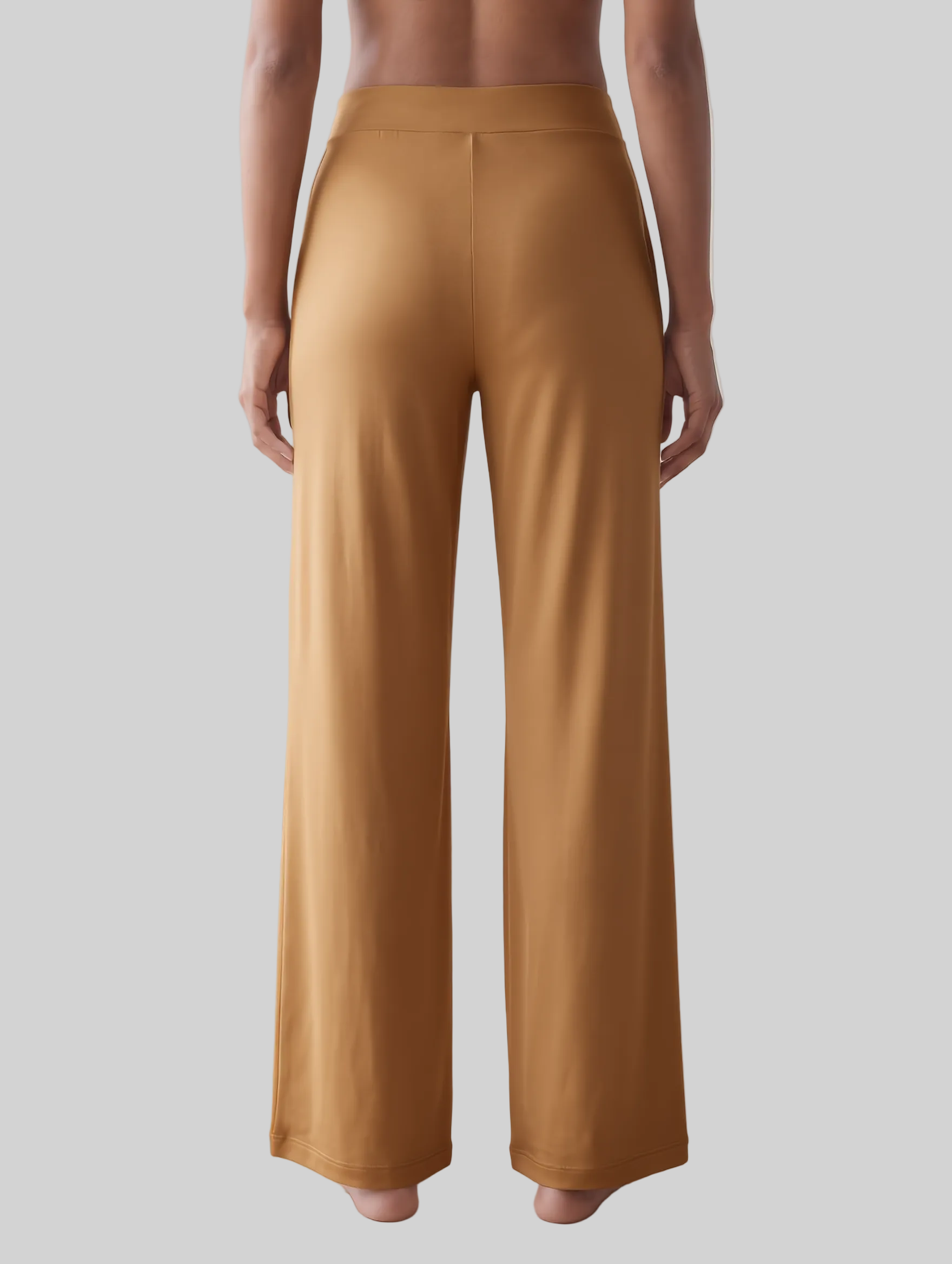 A person shown from the back wearing wide-leg trousers loungewear