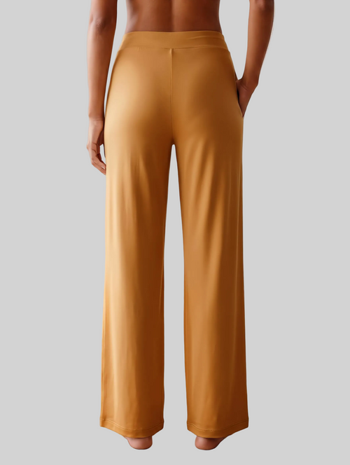 A person shown from the back wearing high-waisted, wide-leg trousers loungewear