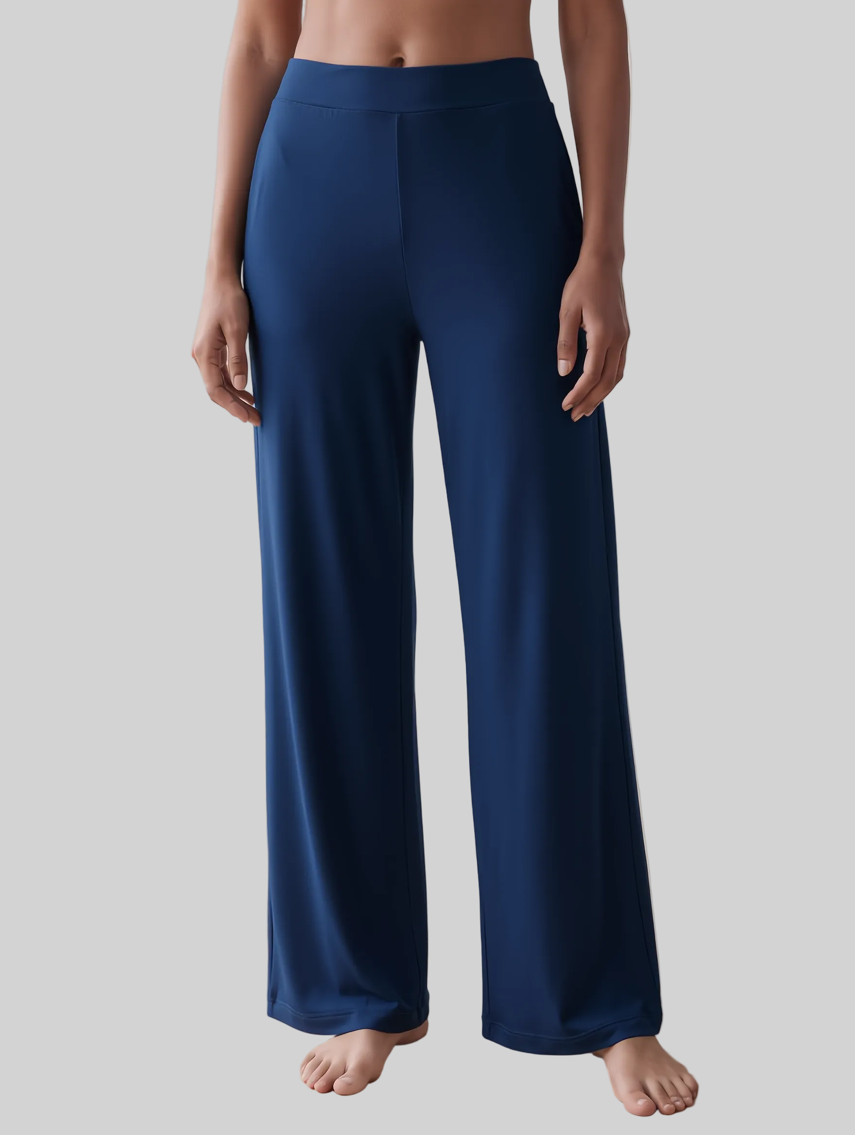 A person wearing high-waisted, wide-leg midnight blue trousers loungewear